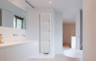Op welke plek in de badkamer mag je je radiator hangen?
